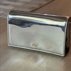 Diane Von Furstenberg Metallic Silver sleek crossbody bag w/ gold colored chain